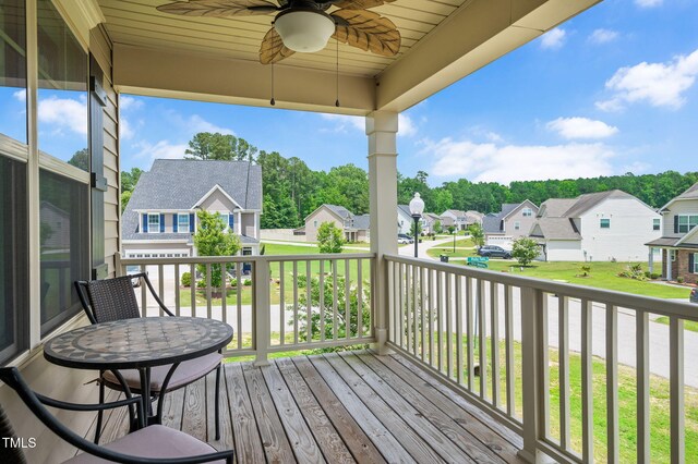 5637 Garnet Meadow Rd, Knightdale, NC 27545 - wooden deck featuring a residential view, a ceiling fan, and view of wooded area