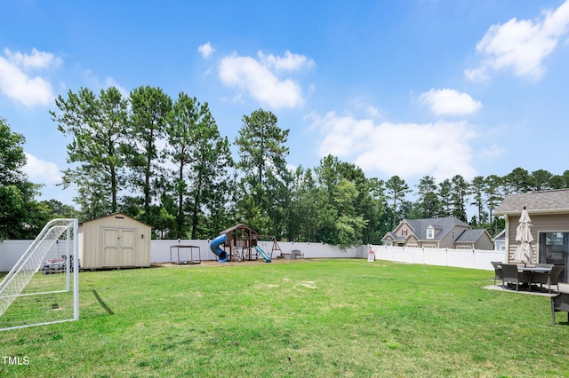 5637 Garnet Meadow Rd, Knightdale, NC 27545 - fenced backyard featuring a playground and a storage unit