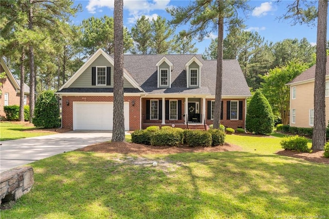 60 Rolling Pines Dr, Spring Lake, NC 28390 - new england style home with concrete driveway, a garage, brick siding, a front yard, and a shingled roof
