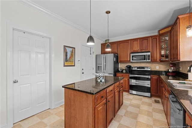 60 Rolling Pines Dr, Spring Lake, NC 28390 - kitchen with stainless steel appliances, a sink, crown molding, glass insert cabinets, and brown cabinets