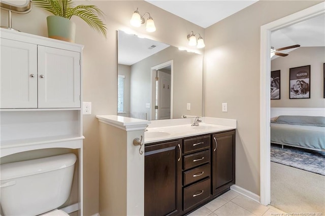 18 Hallow Oak St, Spring Lake, NC 28390 - bathroom with toilet, ceiling fan, double vanity, connected bathroom, and tile patterned floors
