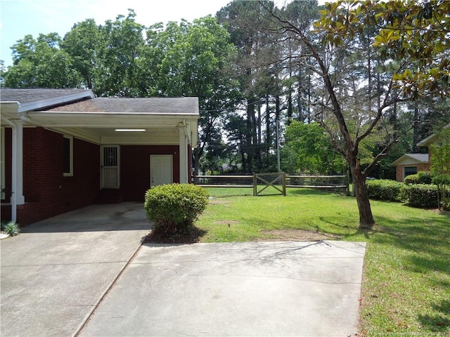 711 Fairview St, Fayetteville, NC 28312 - view of yard featuring driveway and an attached carport