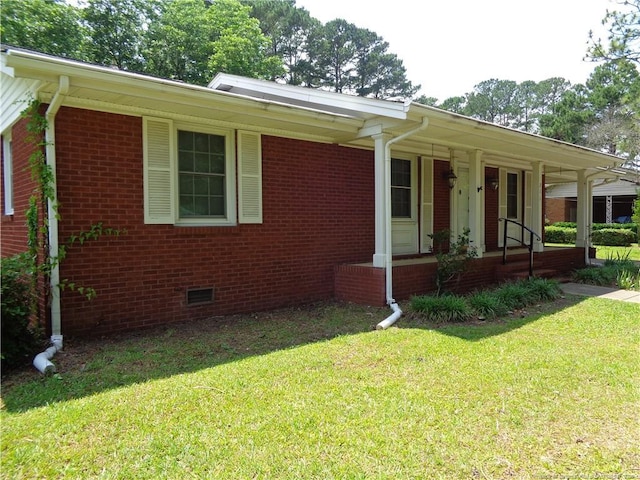 711 Fairview St, Fayetteville, NC 28312 - ranch-style home with covered porch, a front lawn, brick siding, and crawl space