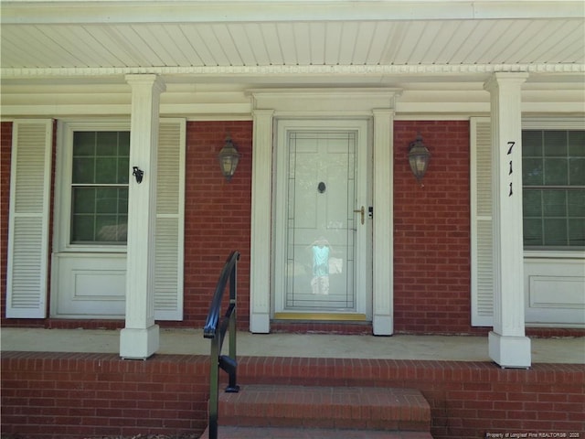 711 Fairview St, Fayetteville, NC 28312 - property entrance featuring brick siding and a porch