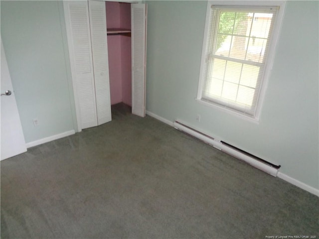 711 Fairview St, Fayetteville, NC 28312 - unfurnished bedroom with a baseboard heating unit, carpet flooring, a closet, and baseboards