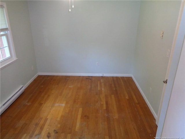 711 Fairview St, Fayetteville, NC 28312 - spare room with hardwood / wood-style floors, a baseboard heating unit, and baseboards