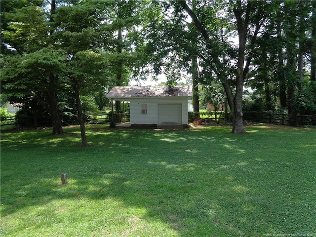 711 Fairview St, Fayetteville, NC 28312 - view of yard with a garage
