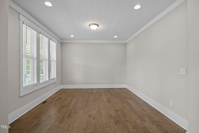 7410 Chouder Ln, Wake Forest, NC 27587 - spare room featuring dark wood-type flooring, crown molding, and recessed lighting