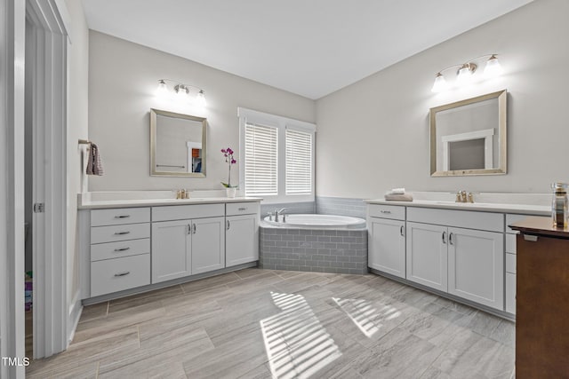 7410 Chouder Ln, Wake Forest, NC 27587 - full bathroom featuring two vanities and a garden tub