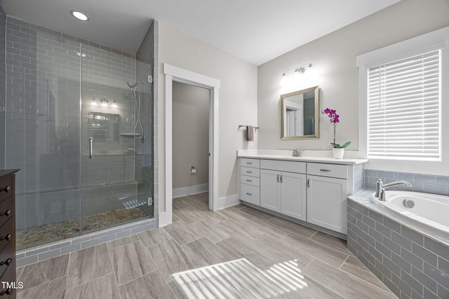 7410 Chouder Ln, Wake Forest, NC 27587 - bathroom with vanity, a stall shower, a bath, and recessed lighting
