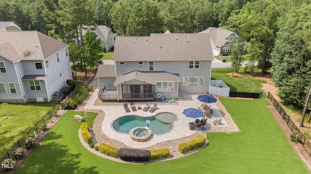 7410 Chouder Ln, Wake Forest, NC 27587 - back of house with a sunroom, a fenced backyard, roof with shingles, a pool with connected hot tub, and stairs