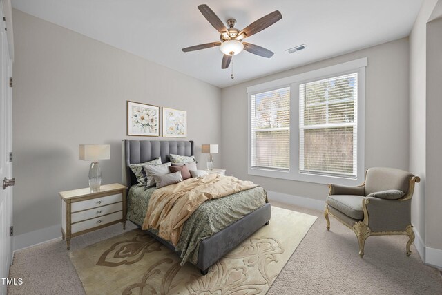 7410 Chouder Ln, Wake Forest, NC 27587 - carpeted bedroom featuring baseboards and a ceiling fan