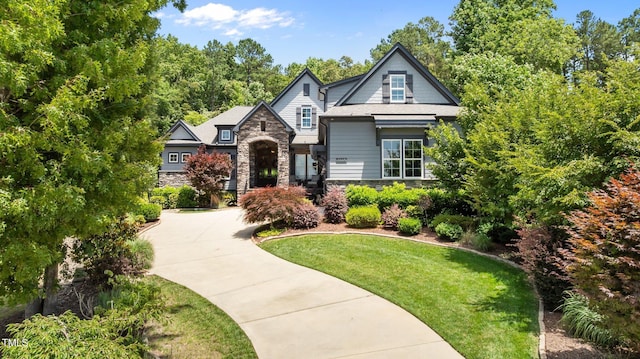 2112 Colin Hill Ct, Wake Forest, NC 27587 - view of front of house with stone siding, a front yard, and concrete driveway