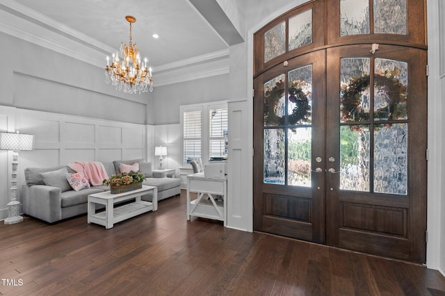 2112 Colin Hill Ct, Wake Forest, NC 27587 - foyer with a decorative wall, a chandelier, ornamental molding, dark wood-style flooring, and french doors