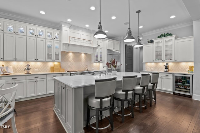 2112 Colin Hill Ct, Wake Forest, NC 27587 - kitchen with wine cooler, built in fridge, backsplash, light countertops, and crown molding
