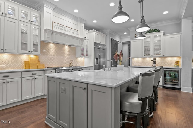 2112 Colin Hill Ct, Wake Forest, NC 27587 - kitchen featuring appliances with stainless steel finishes, wine cooler, recessed lighting, white cabinetry, and a center island with sink