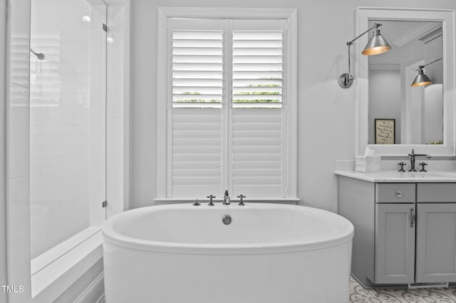 2112 Colin Hill Ct, Wake Forest, NC 27587 - bathroom with a soaking tub, vanity, and a stall shower