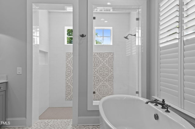 2112 Colin Hill Ct, Wake Forest, NC 27587 - bathroom featuring a freestanding tub, a tile shower, and vanity