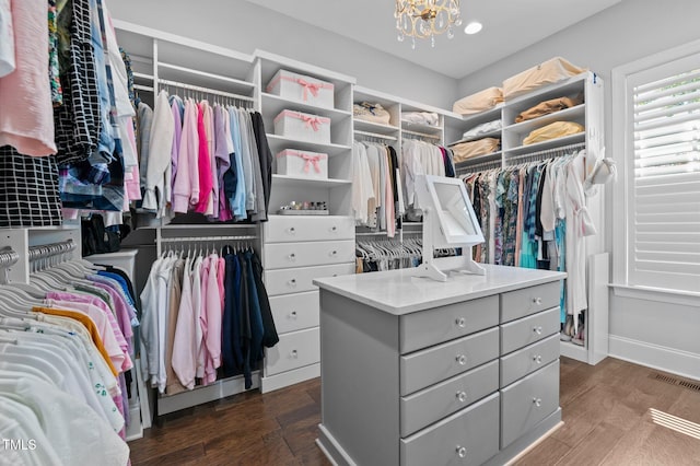 2112 Colin Hill Ct, Wake Forest, NC 27587 - walk in closet with a chandelier and dark wood-style flooring