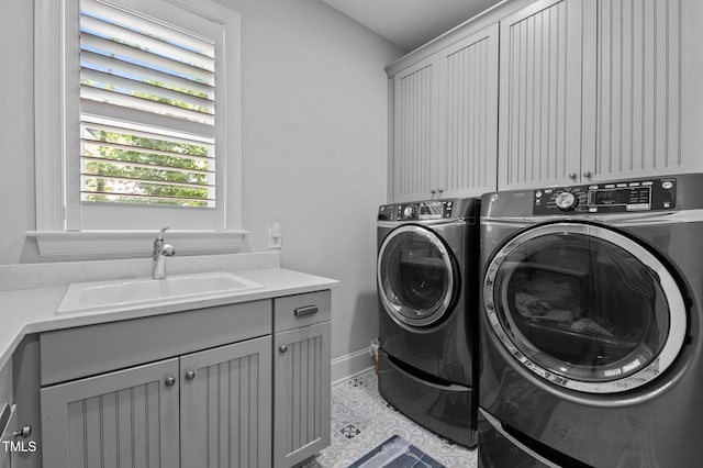 2112 Colin Hill Ct, Wake Forest, NC 27587 - laundry room featuring cabinet space, washer and dryer, and tile patterned floors