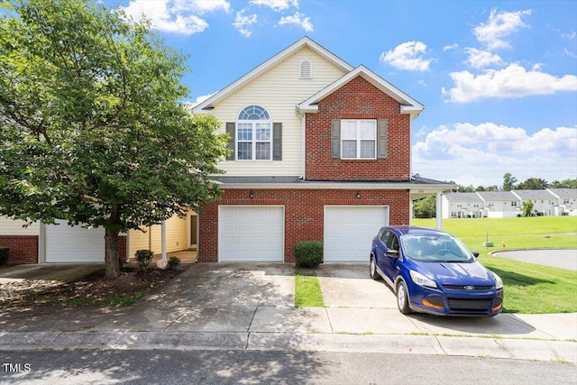 1109 Hadel Pl, Knightdale, NC 27545 - view of front of property featuring driveway, an attached garage, brick siding, and a front lawn