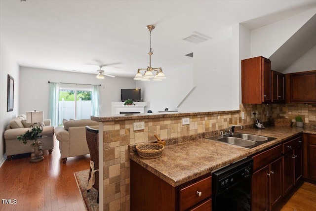 1109 Hadel Pl, Knightdale, NC 27545 - kitchen with dishwasher, open floor plan, tasteful backsplash, and a peninsula