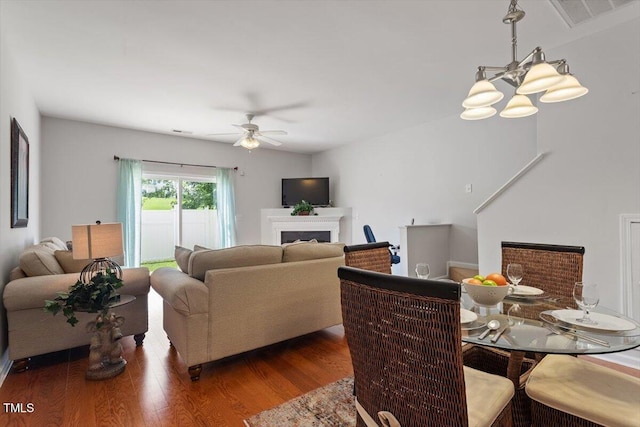 1109 Hadel Pl, Knightdale, NC 27545 - dining room featuring a ceiling fan, a fireplace, and wood finished floors