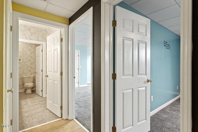 8415 Meadow View Ln, Bahama, NC 27503 - corridor featuring a paneled ceiling, light tile patterned floors, and light colored carpet
