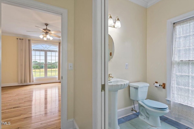 8415 Meadow View Ln, Bahama, NC 27503 - bathroom featuring crown molding, a ceiling fan, and wood finished floors
