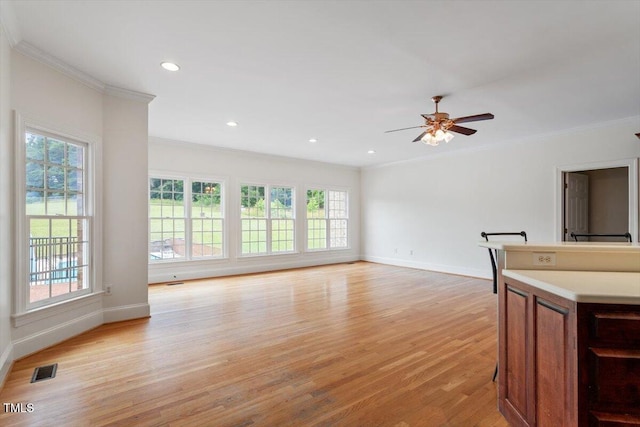 8415 Meadow View Ln, Bahama, NC 27503 - unfurnished living room featuring ornamental molding, healthy amount of natural light, light wood-style flooring, a ceiling fan, and recessed lighting