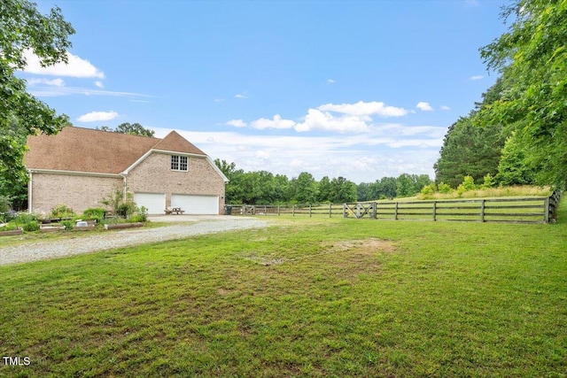 8415 Meadow View Ln, Bahama, NC 27503 - view of yard featuring an attached garage and driveway