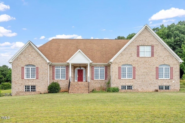 8415 Meadow View Ln, Bahama, NC 27503 - view of front of house featuring a front lawn, brick siding, and a shingled roof