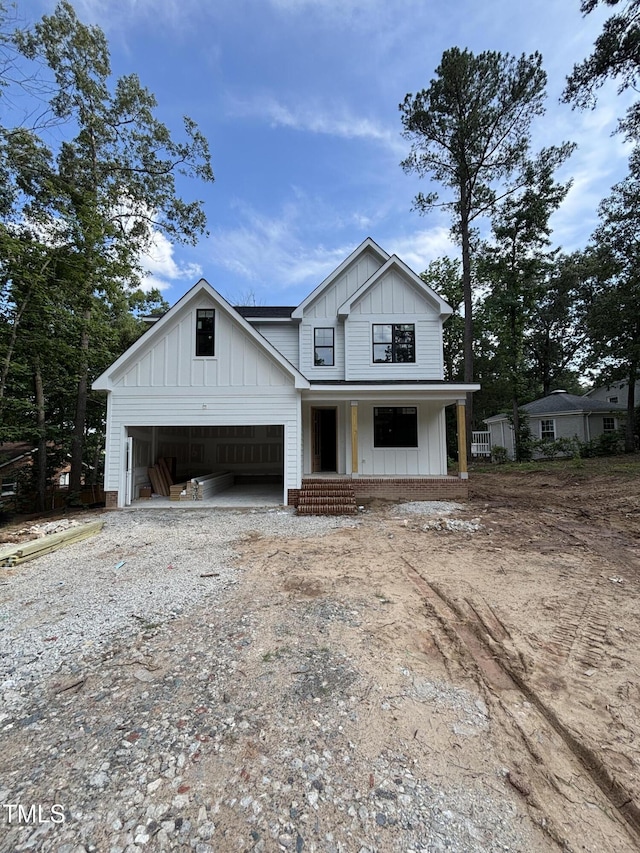 4035 King Charles Rd, Durham, NC 27707 - modern inspired farmhouse featuring board and batten siding, driveway, and a porch