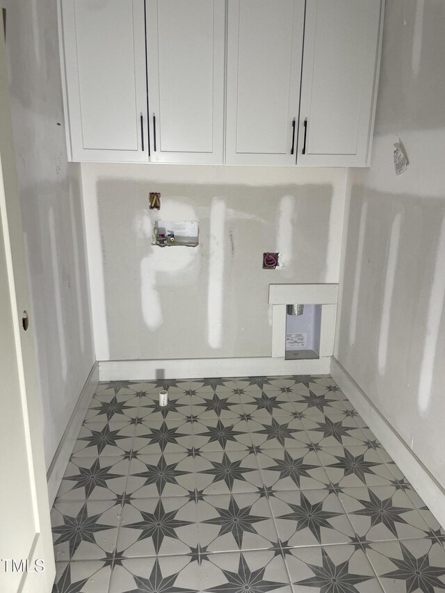 4035 King Charles Rd, Durham, NC 27707 - laundry area featuring light flooring, cabinet space, and hookup for a washing machine