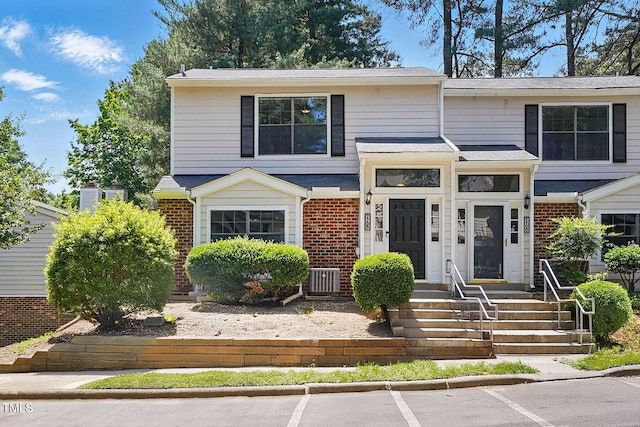 7708 Falcon Rest Cir, Raleigh, NC 27615 - view of front of house featuring brick siding and uncovered parking