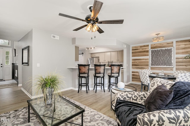 7708 Falcon Rest Cir, Raleigh, NC 27615 - living area with a ceiling fan and light wood-type flooring