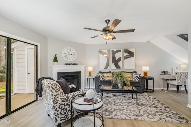 7708 Falcon Rest Cir, Raleigh, NC 27615 - living room featuring wood finished floors, a fireplace, and ceiling fan