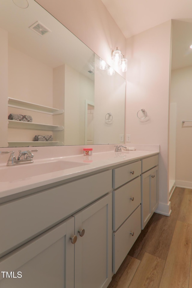 202 E S St, Fremont, NC 27830 - full bathroom with double vanity and wood finished floors