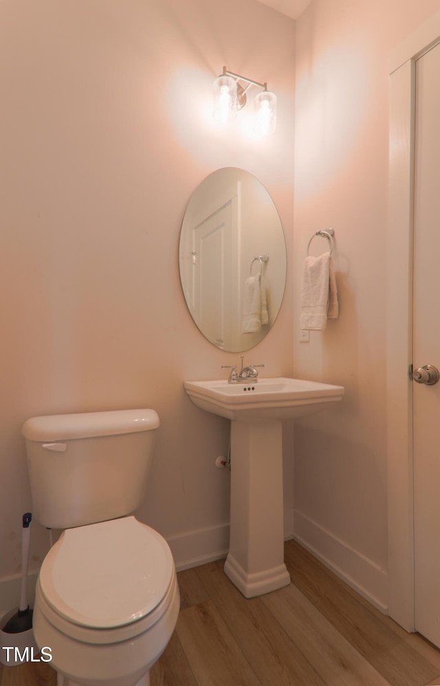 202 E S St, Fremont, NC 27830 - bathroom featuring wood finished floors and baseboards