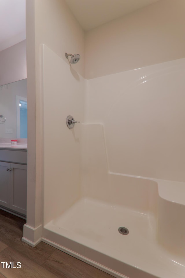 202 E S St, Fremont, NC 27830 - full bathroom with wood finished floors, a shower, and vanity