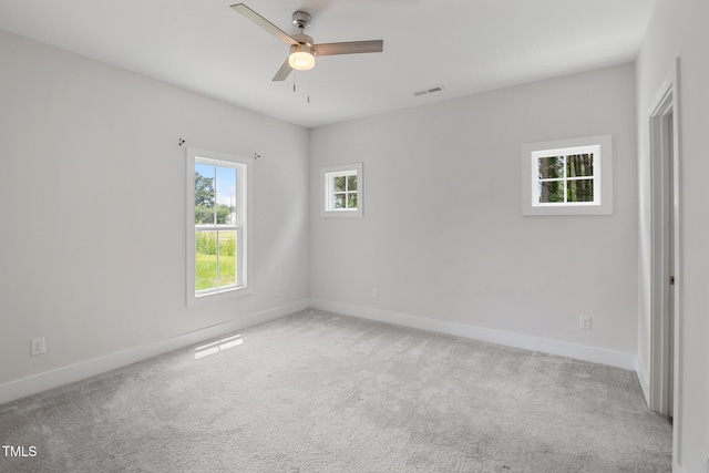 202 E S St, Fremont, NC 27830 - empty room with a ceiling fan and light colored carpet