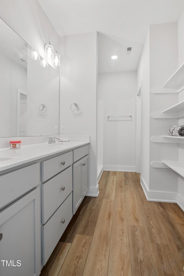 202 E S St, Fremont, NC 27830 - bathroom with double vanity and wood finished floors