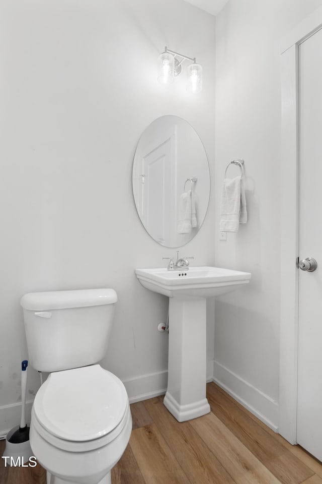 202 E S St, Fremont, NC 27830 - half bath featuring wood finished floors and baseboards
