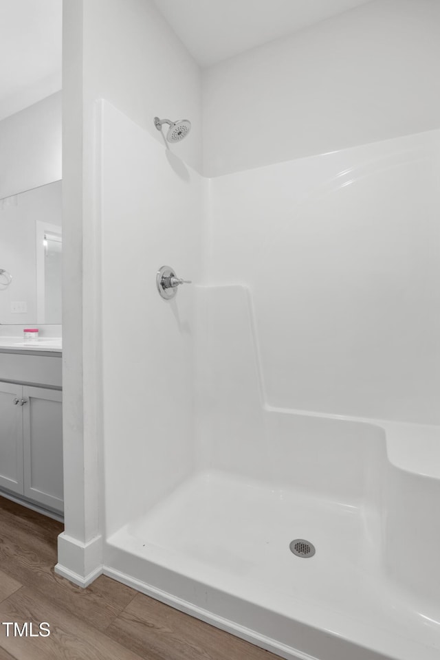 202 E S St, Fremont, NC 27830 - bathroom with wood finished floors, a shower, and vanity