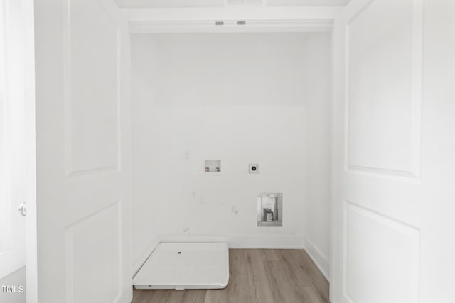202 E S St, Fremont, NC 27830 - laundry room featuring hookup for an electric dryer, light wood-type flooring, and hookup for a washing machine