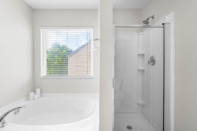 2011 Unbridled Dr, Knightdale, NC 27545 - bathroom featuring a stall shower and a bath