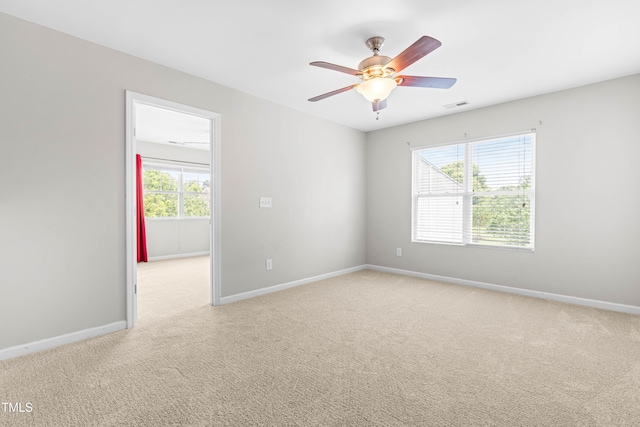 2011 Unbridled Dr, Knightdale, NC 27545 - carpeted empty room featuring plenty of natural light and baseboards