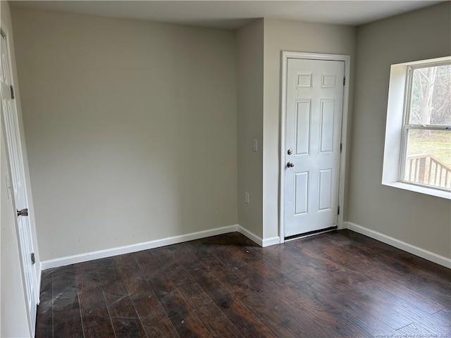 1914 Slater Ave, Fayetteville, NC 28301 - unfurnished bedroom with dark wood-style floors and baseboards