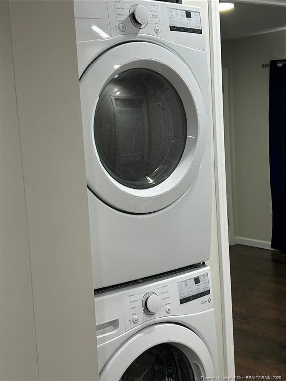 1914 Slater Ave, Fayetteville, NC 28301 - laundry room featuring stacked washing machine and dryer, wood finished floors, and baseboards