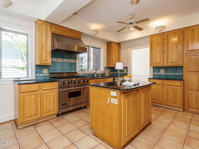 907 W Johnson St, Raleigh, NC 27605 - kitchen with designer stove, extractor fan, backsplash, and a center island